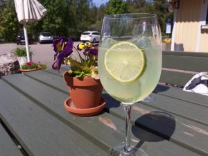 Refreshing summer drink at På Krogen Restaurant's terrace table.